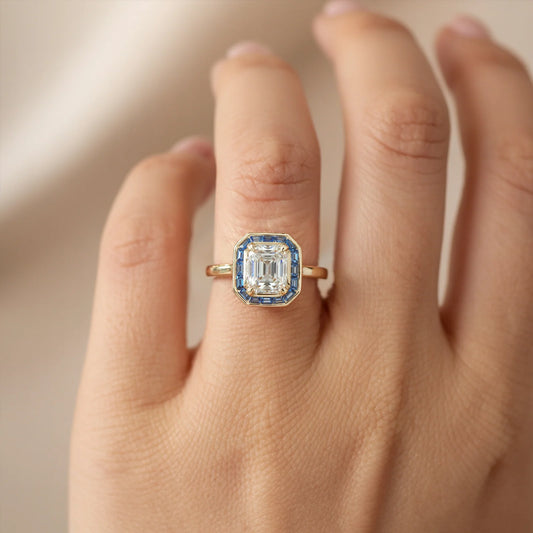 The Indigo Whisper 1CT Emerald Cut Halo Moissanite Ring