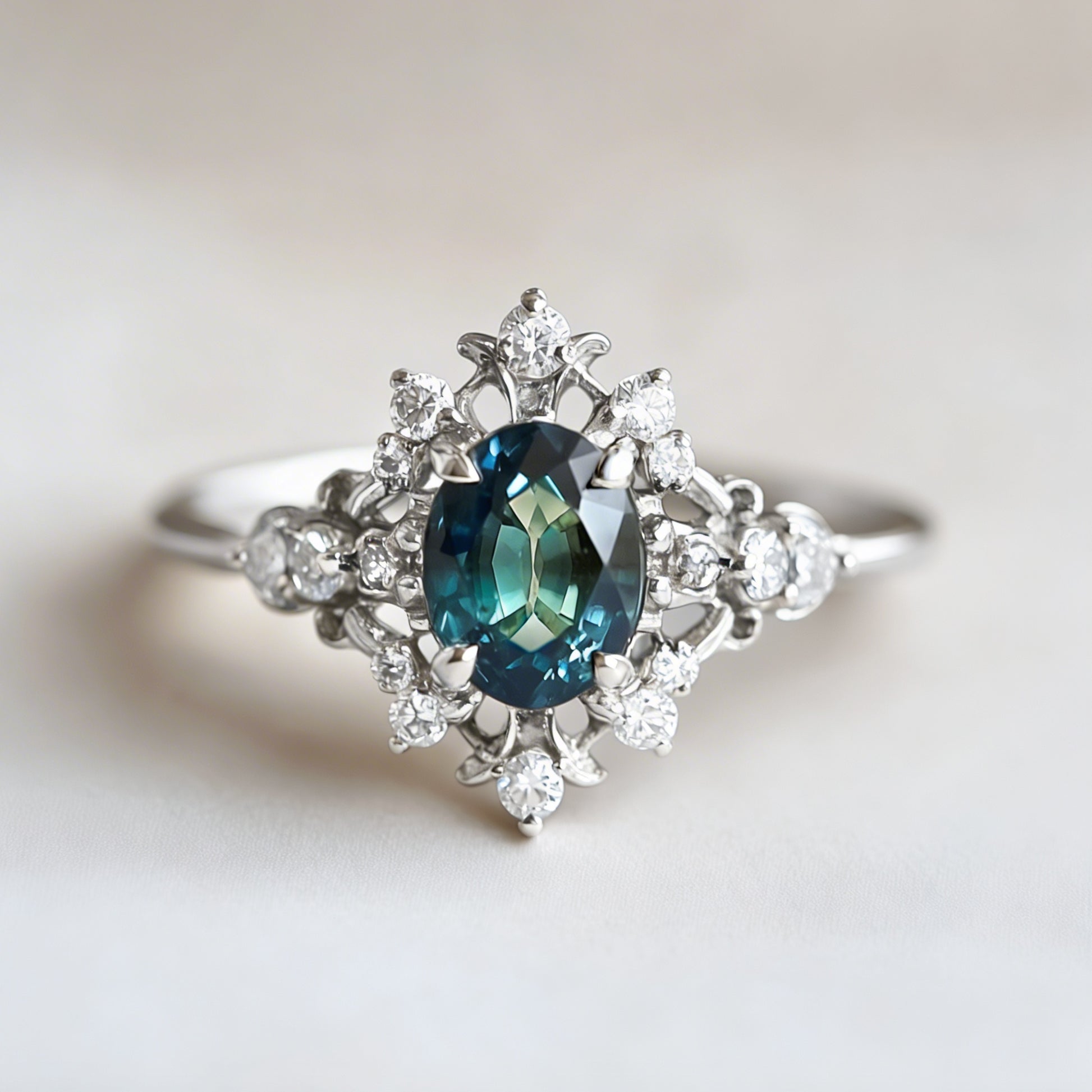 Isis' Crown Ring – Teal Sapphire & Diamond Halo Engagement Ring