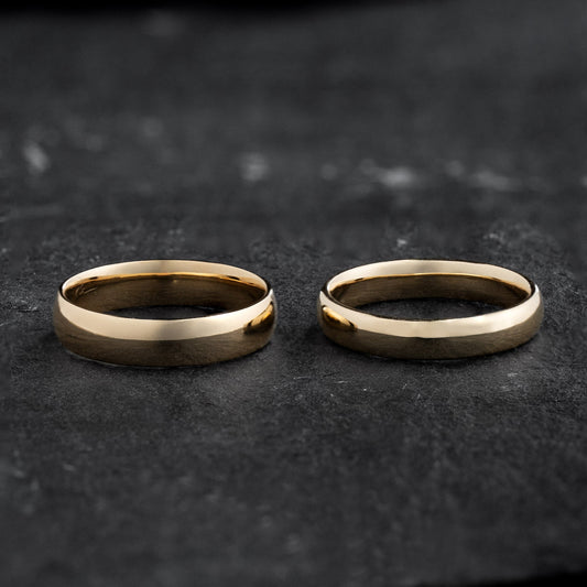 The Mirrored Pair – Polished Arc Wedding Bands in Solid Gold