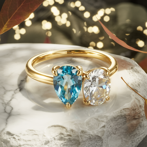 The Celestria 1CT Pear Cut Blue Moissanite & 1CT Oval Cut Moissanite Ring