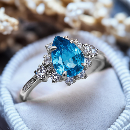 The Bethany 2CT Pear Cut Blue Moissanite Halo Ring