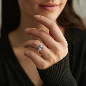 The Celestria 1CT Pear Cut Blue Moissanite & 1CT Oval Cut Moissanite Ring