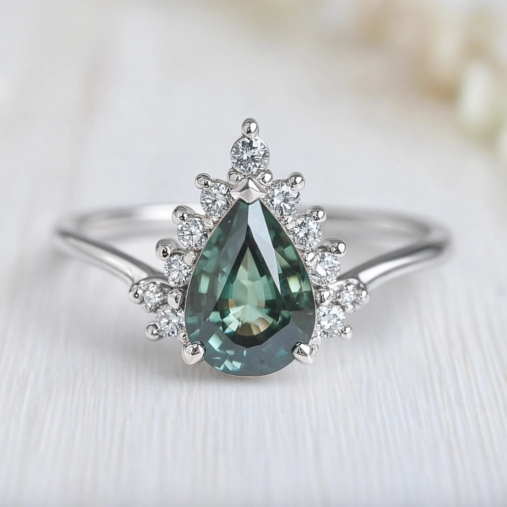 Mermaid’s Crown | Pear Teal Sapphire Halo Engagement Ring