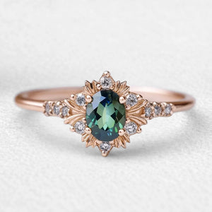 Enshrined Glow | Vintage Oval Cut Emerald Halo Engagement Ring