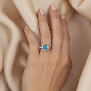 The Bethany 2CT Emerald Cut Blue Moissanite Halo Ring