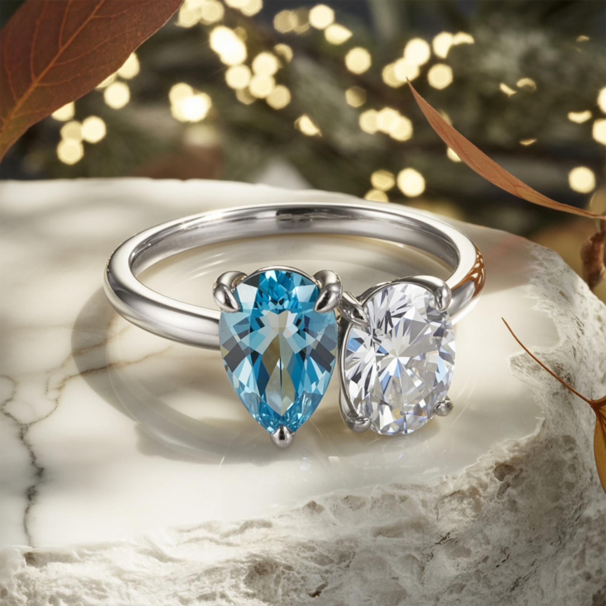 The Celestria 1CT Pear Cut Blue Moissanite & 1CT Oval Cut Moissanite Ring