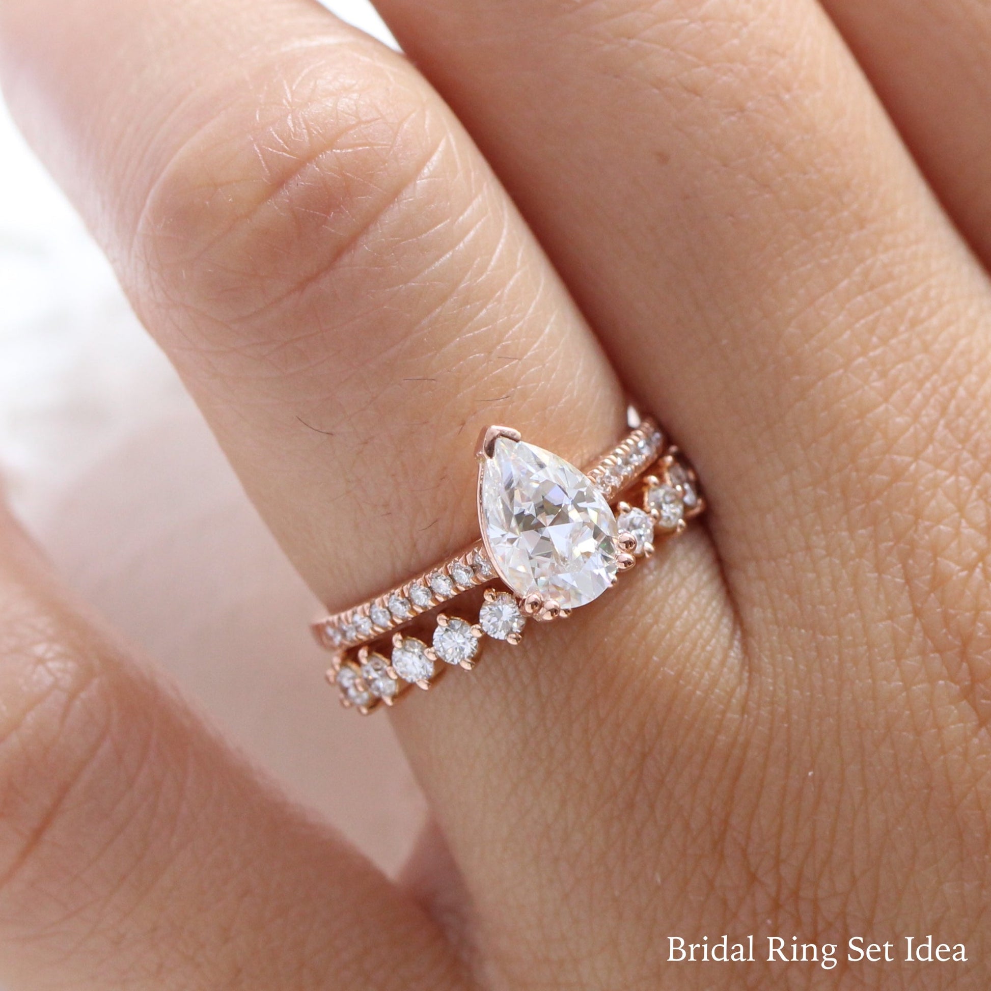 Pear Moissanite Engagement Ring in Grace Solitaire Pave Diamond Band