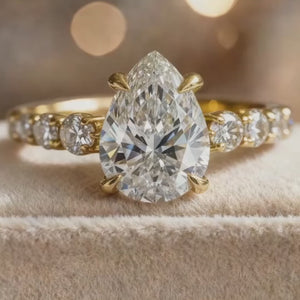 Aurora‘s Whisper | 2CT Pear Cut Moissanite Eternity Ring